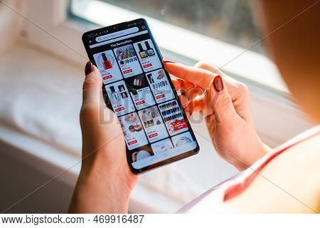 Kyiv, Ukraine - November 26, 2019: Woman Holding Phone With Internet Shopping Service Aliexpress On 