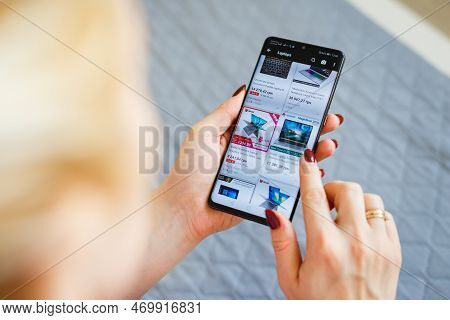 Kyiv, Ukraine - November 26, 2019: Woman Holding Phone With Internet Shopping Service Aliexpress On 