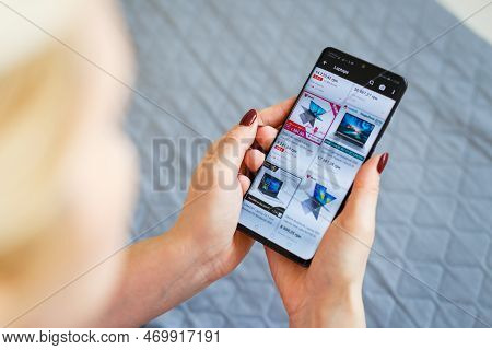 Kyiv, Ukraine - November 26, 2019: Woman Holding Phone With Internet Shopping Service Aliexpress On 