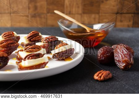Snack Set (starters, Appetizers) With Dates, Brie Or Camambert Cheese, Pecan Nuts And Natural Organi