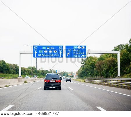 Austria - Sep 30, 2014: View From The Highway At The Blue Direction Signs Above With Wien, Schwechat
