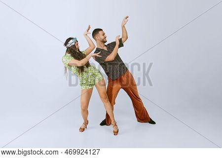 Synchronized Movements. Emotional Young Man And Woman In Sytlish Retro Outfits Dancing Disco Dance I