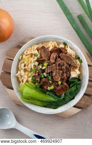Beef Noodle Soup. Taiwanese Famous Food In A Bowl On Wooden Table.