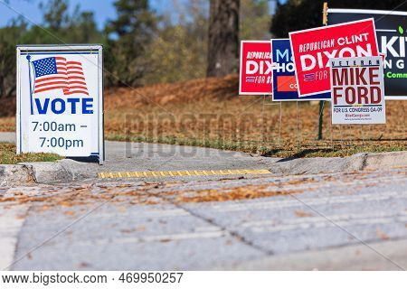 Dacula, Ga / Usa - November 8, 2022:  Election Campaign Yard Signs Sit Across From A Vote Sign At A 