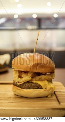 Beef Brisket Burger Which Contain Bearnaise Sauce, Tomato, Relish, Onion Rings And Mozzarella Cheese