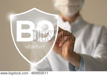 Molecular Model Of Vitamin B9. Shield In Doctor`s Hands With Vitamin B9.