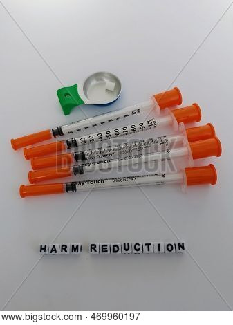 Harm Reduction Safer Injection Kit Needles And Cooker On A White Background