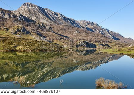 Picturesque Reservoir And Mountain Landscape In Riano. Mirror Effect. Spain