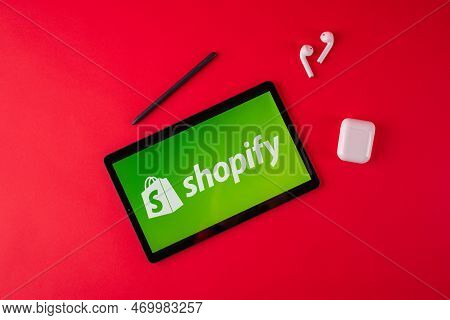 Tula, Russia - August 19, 2021: Shopify Displayed On A Sumsung Modern Laptop On Red Background