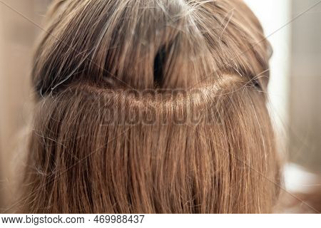 Hair Ribbons For Extensions On A Woman\'s Head At Home. Hair Extensions To Thicken Your Own. Individ