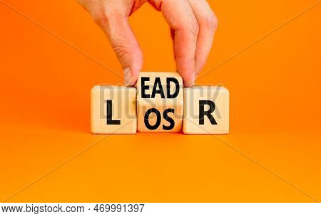 Leader Or Loser Symbol. Concept Word Leader Loser On Wooden Cubes. Beautiful Orange Table Orange Bac