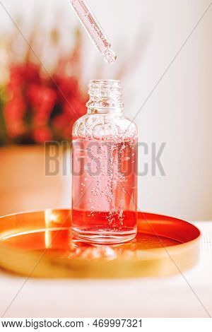 Pipette And Transparent Bottle With Serum, Gel, Oil Or Other Cosmetic Product. Trendy Selfcare Beaut