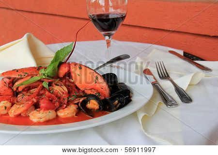 Out door restaurant with meal of Seafood Fradiavolo