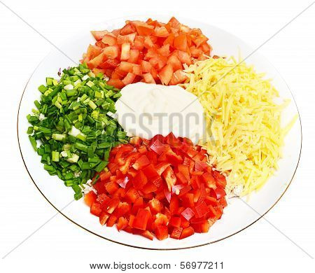 A salad of tomatoes, peppers, cheese, onions and mayonnaise