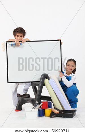 Two children pretending to be decorating