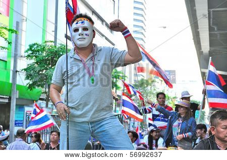 Bangkok-january 13: Unidentified Protestor Wearing White Mask  In Anti-government Group On Rama 4 St