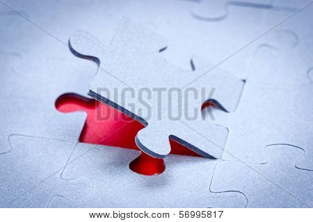 Piece Of Puzzle Revealing Red Background
