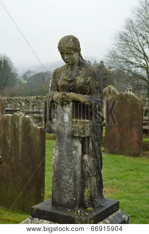 Solemn Tombstone Lady with Cross