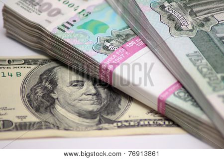 Hundred dollars and two packs to one thousand rouble banknotes