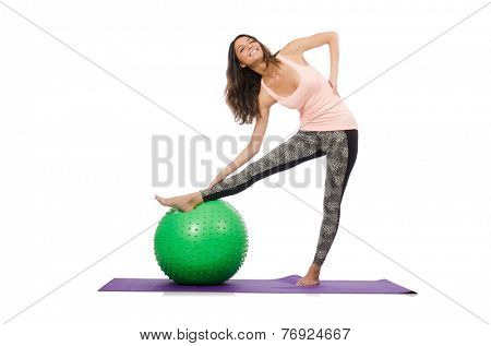 Young woman exercising with swiss ball
