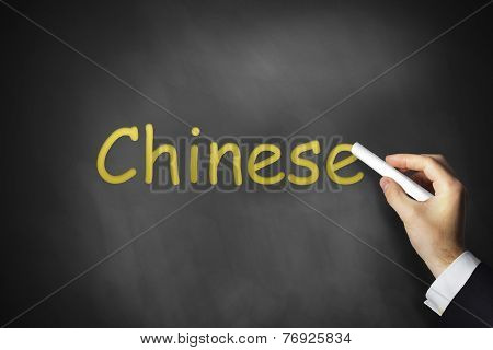 Hand Writing Chinese On Black Chalkboard