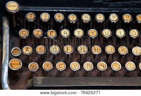 ancient rusty typewriter with white keys very old