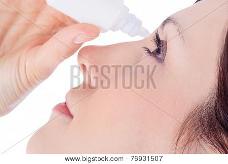 Woman Dripping Eye With Eyes Drops