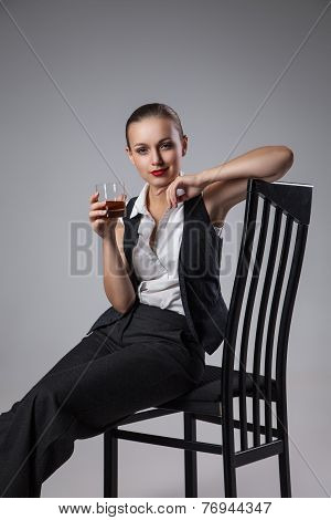 Mafiosi woman with brandy. Fashion photo