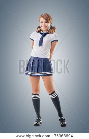 Japanese style school girl in sailor suit, full length portrait.