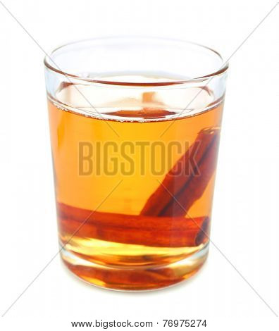 Apple cider with cinnamon sticks, isolated on white