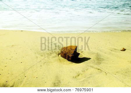 Red rock on the beach