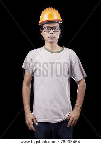 People Portrait Of Young Asian Worker Man Wearing Safety Helmet Standing On Black Background With St