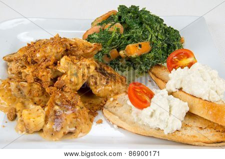 Chicken with sauce and garnish.
