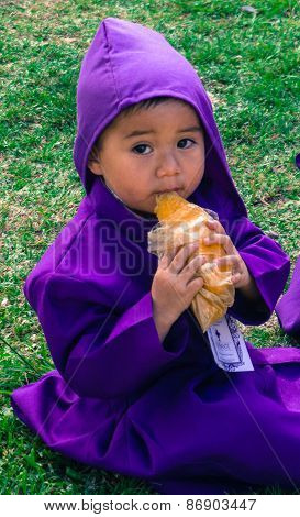 child waiting for Lent procession
