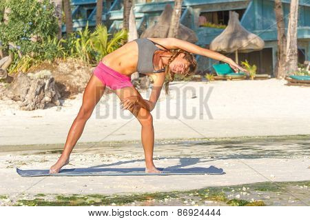 young beautiful happy smiling woman doing bodyflex, fitness, sport workout outdoors on natural background