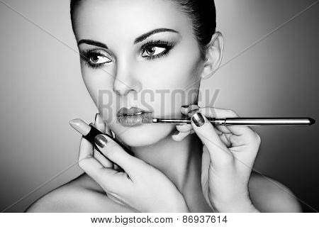 Makeup Artist Applies Lipstick