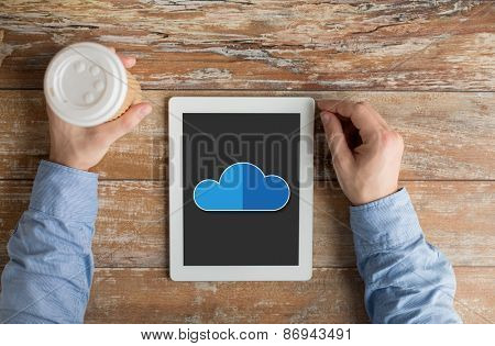 business, education, people and technology concept - close up of male hands with cloud computing icon on tablet pc computer screen and coffee cup at table