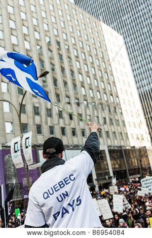 Separatist Protester Holding The Fleur De Lys Quebec Province Flag