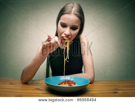 Girl eating pasta 