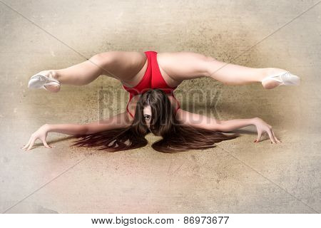 Young Female Contortionist, On Grunge Background