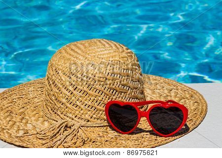 utensils for a nice relaxing vacation day lying next to a swimming pool. relaxation on vacation.