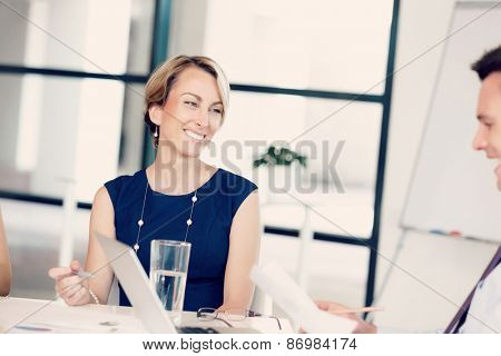 Businesswoman doing a presentaion in front of her collegues