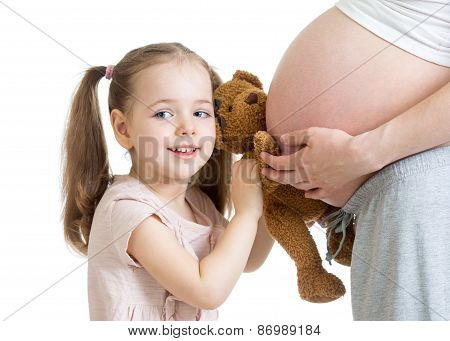 happy kid girl playing with pregnant mother