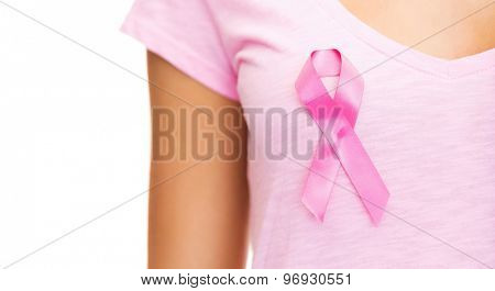 healthcare and medicine concept - woman in blank t-shirt with pink breast cancer awareness ribbon
