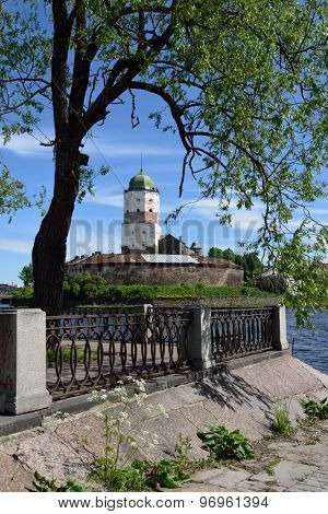 VYBORG, LENINGRAD OBLAST, RUSSIA - JUNE 6, 2015: View to the embankment and the tower of St. Olav of Vyborg Castle. The castle was founded in 1293