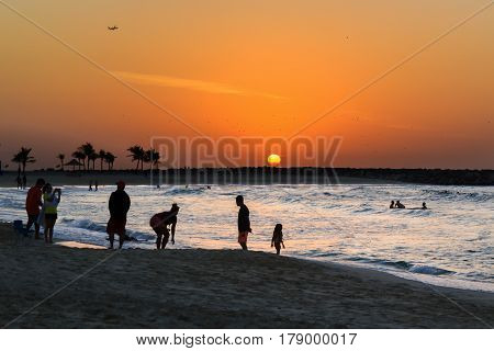 Dubai, UAE - January 7, 2017. Sunset on the beach Al Mamzar. Al Mamzar is one of Dubai's parks. The beach is clean and well-groomed, equipped with changing rooms, toilets and shower cabins. In the park you can engage in active recreation and sports