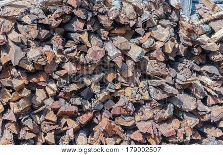 Abstract Background Of Stored Pieces Of Small Wood Ready For Heating, Chopped At Home In The Country