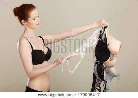 Woman Choosing Bras To Wear