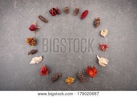 Circle dried decoration plants. Dried florist supplies on stone backgroound.