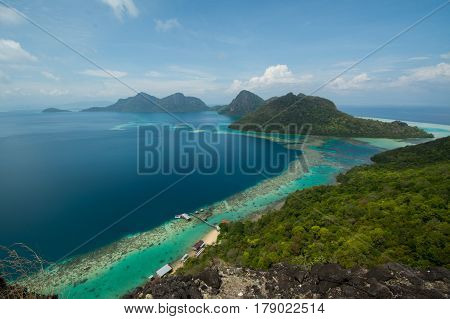 Beautiful tropical Bohey Dulang island with beach and blue water for relax